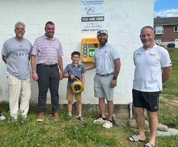 (From left to right) Joe Ferrara, Director of Operation for the Western United Pioneers, Joe Salvador, Western United Pioneers Board Member, Declan Smith, son of Rob Smith, Rob Smith, Lumberjack Hockey Team representative (the team raised funds for the KEVS Foundation through the Kevin G. Major Memorial Hockey Tournament), Hector Gomes, Anna Dias Foundation. (Photo courtesy Town of Ludlow)